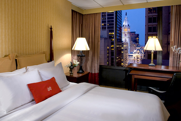 A guest room at the Crowne Plaza Downtown with a view of City Hall